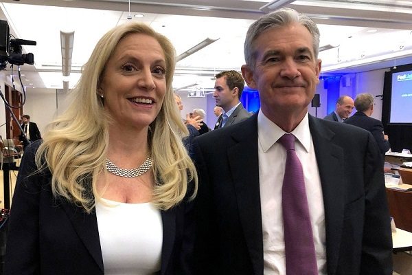FILE PHOTO: Federal Reserve Chairman Jerome Powell poses for photos with Fed Governor Lael Brainard at the Federal Reserve Bank of Chicago